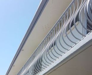 Exterior balcony painting with detailed hand rails in [suburb] Gold Coast